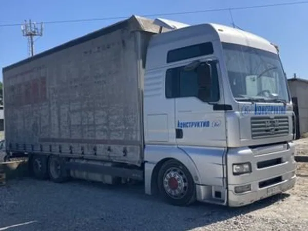 Тентованный грузовик MAN TGA 24.390