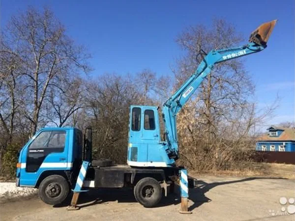 Экскаватор-планировщик Isuzu
