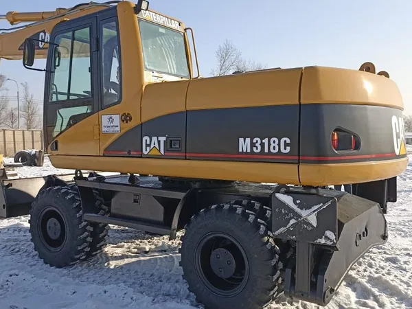 Колесный экскаватор Caterpillar M318