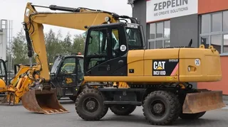 Колесный экскаватор Caterpillar 18M3