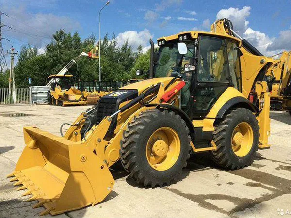 Аренда экскаватора-погрузчика CAT с гидромолотом