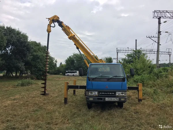 Аренда ямобура. Бурение свай. Установка опор лэп