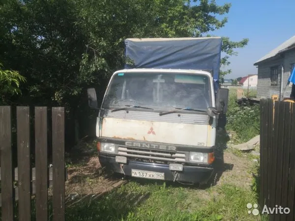 Тентованный автомобиль Mitsubishi Fuso Canter