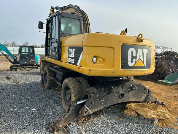 Колесный экскаватор Caterpillar M318D