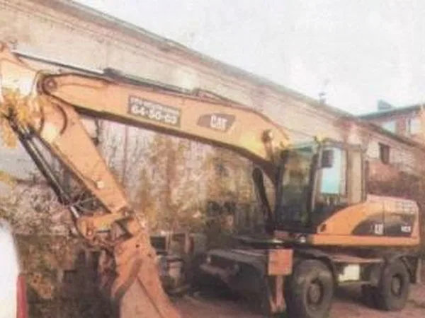 Колесный экскаватор Caterpillar