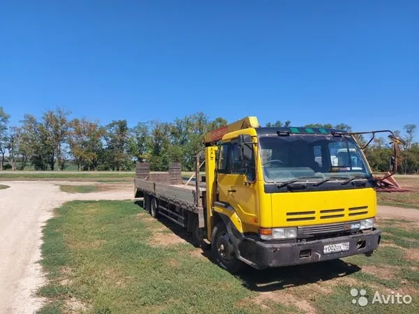 Эвакуатор Nissan Diesel с КМУ