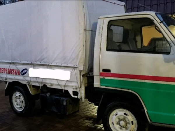 Тентованный аытомобиль Isuzu ELF