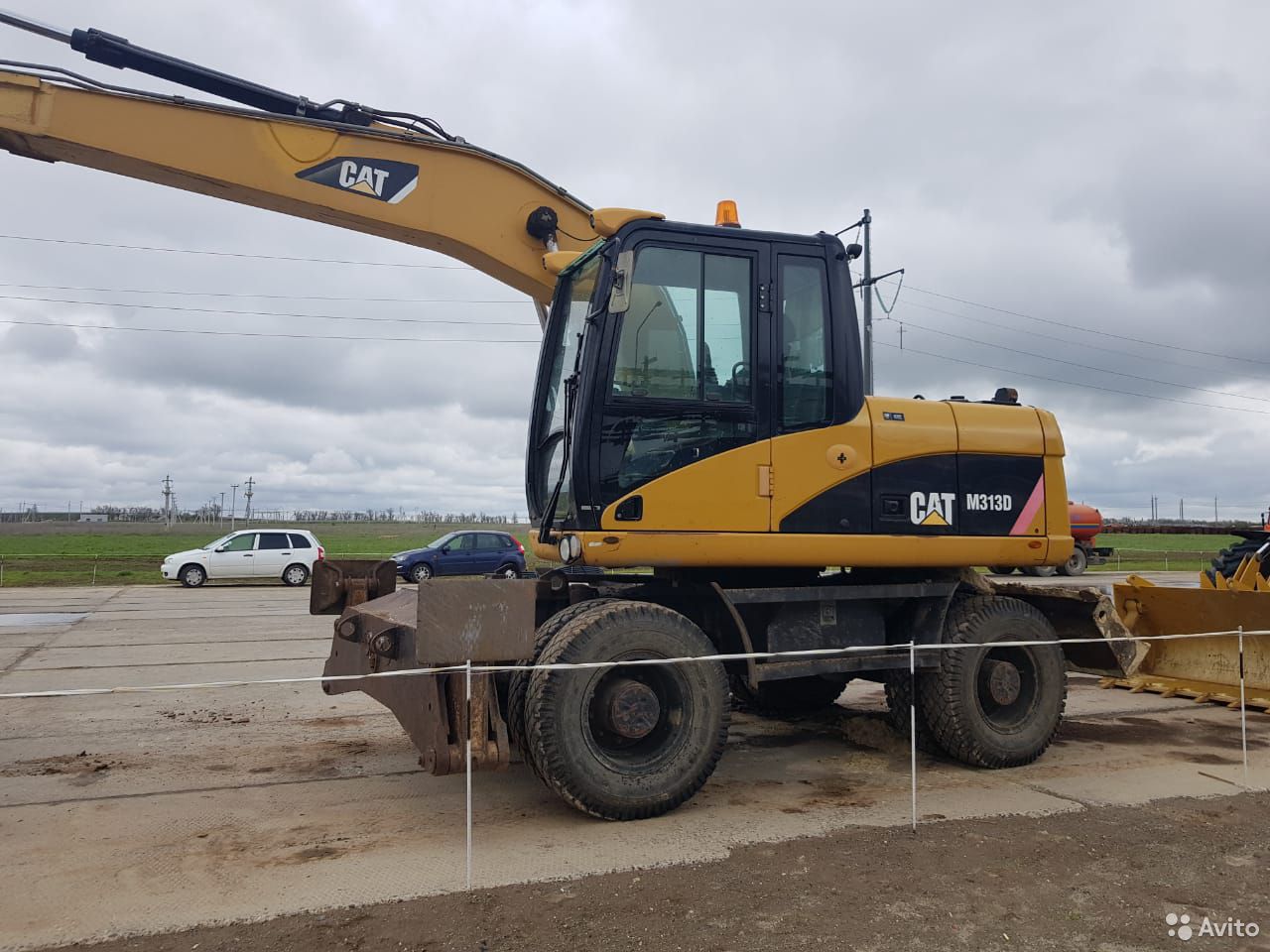 Колесный экскаватор Caterpillar M313D